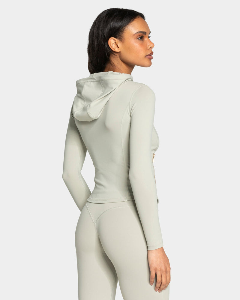 Veste de sport zippée sculptante à capuche Allrounder « pistache/dorée »