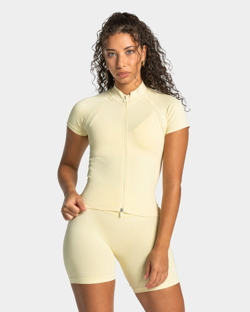 Haut à manches courtes zippé Lift « Butter Yellow »