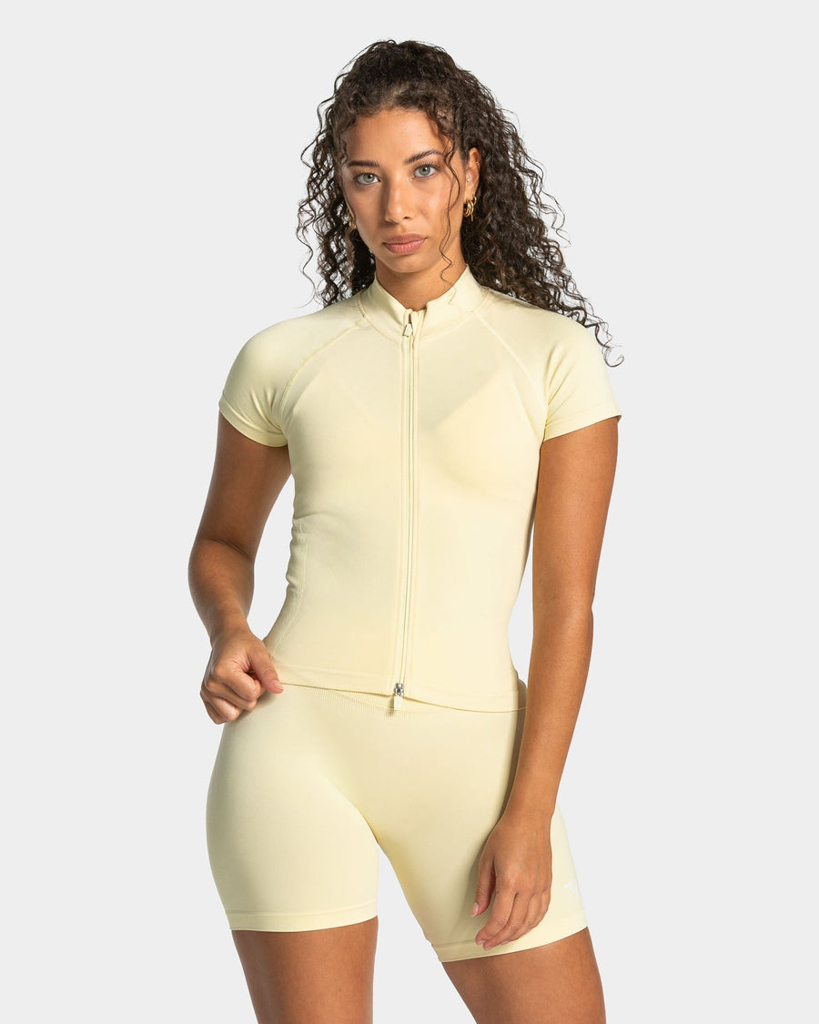 Haut à manches courtes zippé Lift « Butter Yellow »